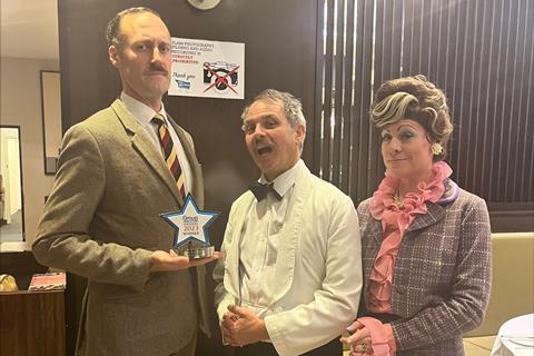 Members of the Faulty Towers The Dining Experience team with their Group Leisure & Travel Award for Best Dining Experience